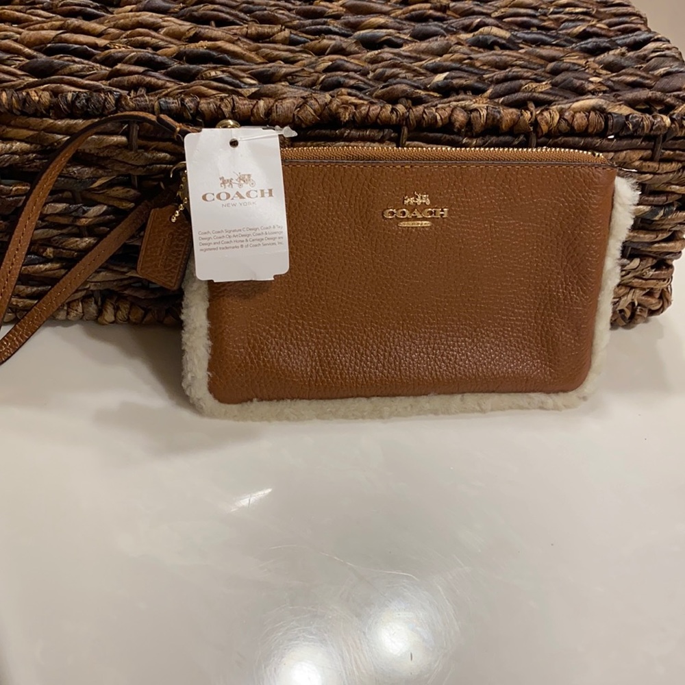Coach Wristlet tan leather  with fur trim